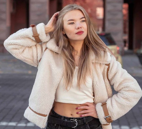 How can you style a bomber jacket for a feminine look?