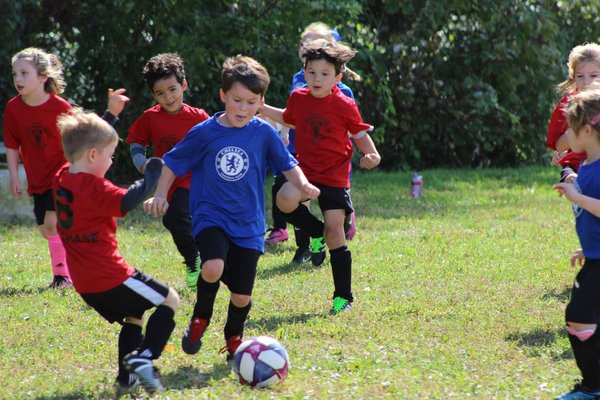 How can sports organizations promote ethical conduct and sportsmanship in youth sports officiating?